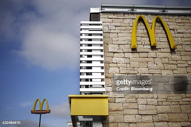 Signage stands outside a McDonald's Corp. Fast food restaurant in White House, Tennessee, U.S., on Wednesday, Jan. 18, 2017. McDonald's shares fell...