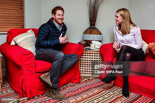 Prince Harry speaks with Head of Psychological Wellbeing Vanessa Moutan during a visit to a Help For Heroes Recovery Centre at Tedworth House on...