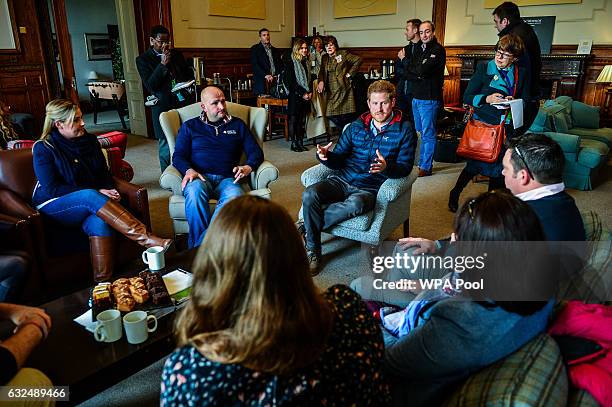 Prince Harry speaks with members of fellowship groups during a visit to a Help For Heroes Recovery Centre at Tedworth House on January 23, 2017 in...