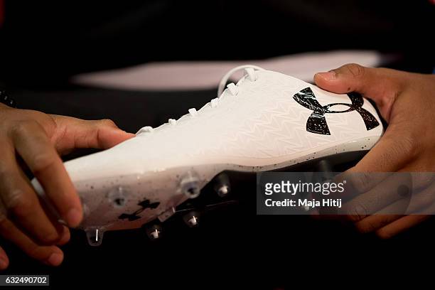 Jonathan Tah of Leverkusen holds a new Under Armour ClutchFit 3.0 football shoe on January 23, 2017 in Dusseldorf, Germany.