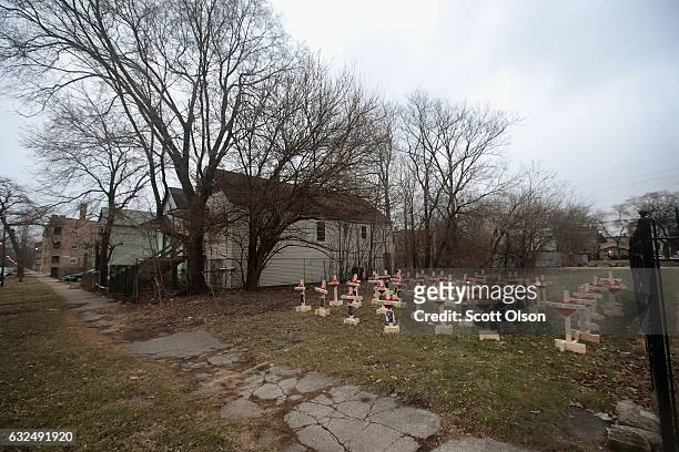 Forty-three crosses sit in a vacant lot in the Englewood neighborhood on January 23, 2017 in Chicago, Illinois. Each cross, created by Greg Zanis,...