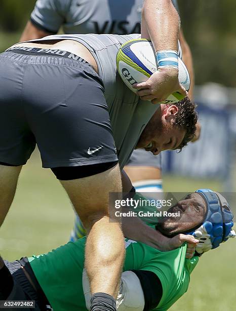 Juan Manuel Leguizamon of Jaguares scuffles with a Julian Montoya of Jaguares B during a friendly match between Jaguares and Jaguares B as part of...