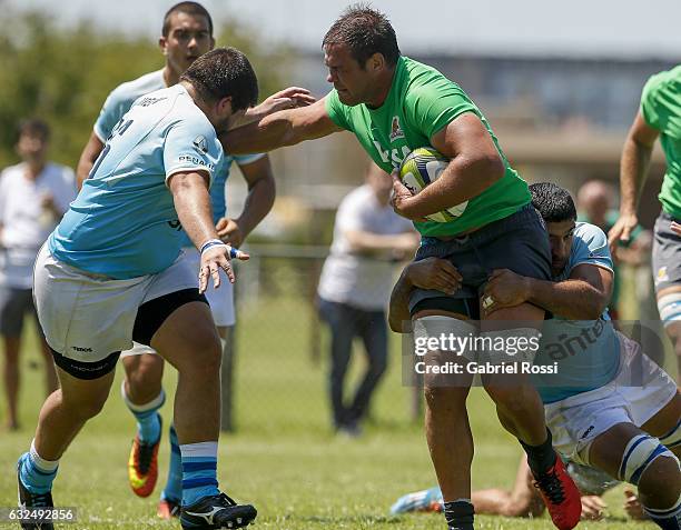 Benjamin Macome of Jaguares is tackled by Rodolfo Garese of Uruguay during a friendly match between Jaguares and Uruguay as part of Jaguares...