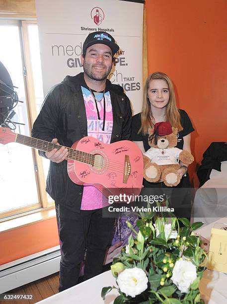 Mike Shay and Patient ambassador for Shriners For Children Medical Center Grace Schleeperand attend EcoLuxe Lounge Ten Years at Sundance on January...