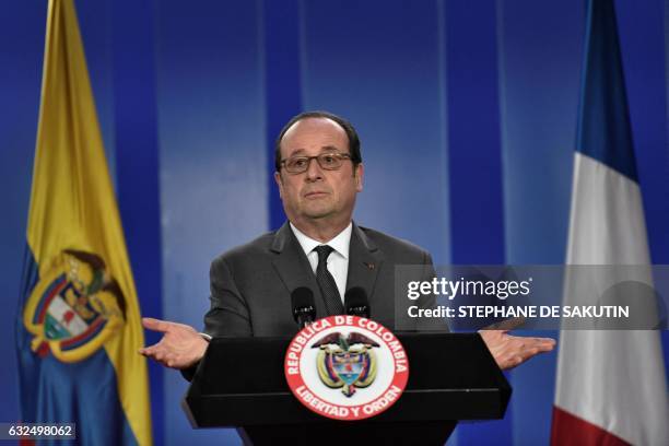 French President Francois Hollande speaks during a press conference offered along with Colombian President Juan Manuel Santos at Narino Palace in...