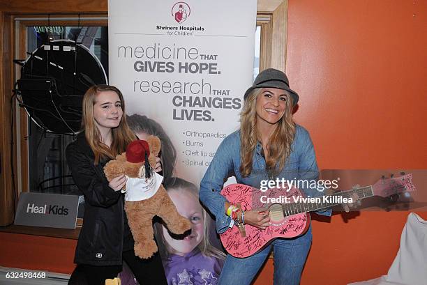 Patient ambassador for Shriners For Children Medical Center Grace Schleeperand and Bridgetta Tomarchio attend EcoLuxe Lounge Ten Years at Sundance on...