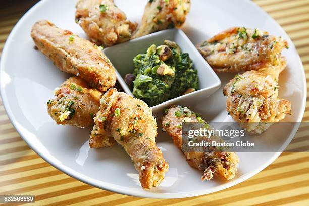 Chicken wings with broccoli rabe pesto by Chef Gordon Hamersley are pictured in Sudbury, MA on Jan. 21, 2016.