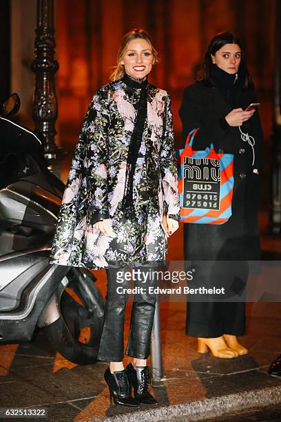 Olivia Palermo is wearing a floral print jacket, black leather pants, and black leather heels, after the Giambattista Valli show, during Paris...