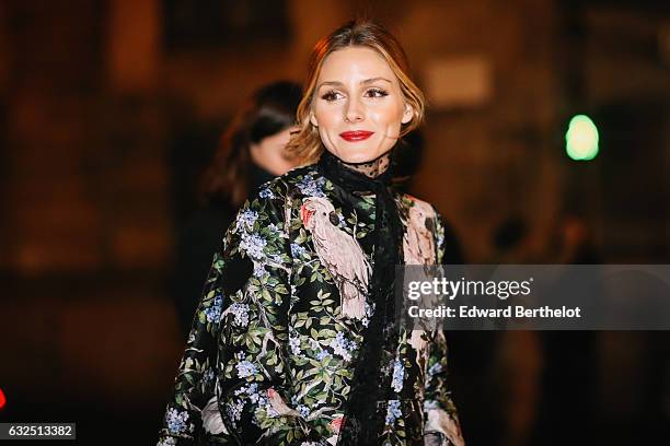 Olivia Palermo is wearing a floral print jacket, black leather pants, and black leather heels, after the Giambattista Valli show, during Paris...