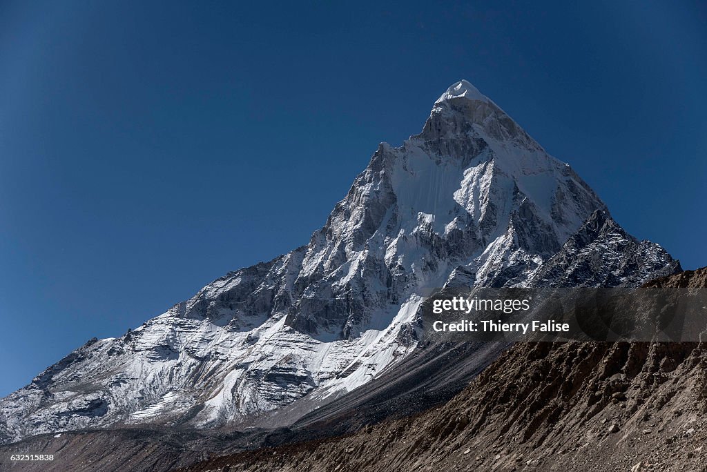 The Shivling peak, culminating at 6,543 meters, stands over...