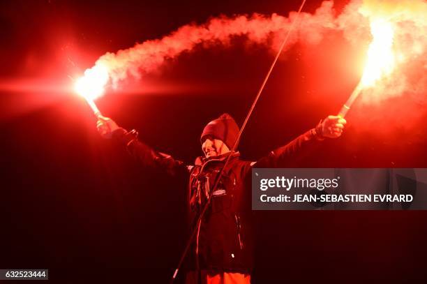 Third-placed French skipper Jeremie Beyou celebrates as he arrives aboard his class Imoca monohull "Maitre Coq" after crossing the finish line of the...