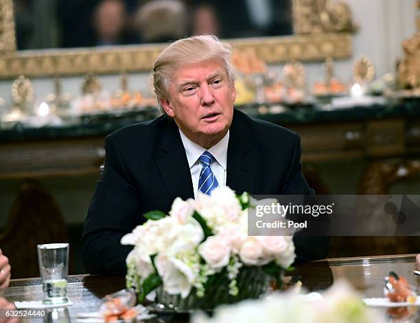 President Donald Trump hosts a reception for House and Senate Republican and Democratic leaders in the State Dining Room of the White House January...