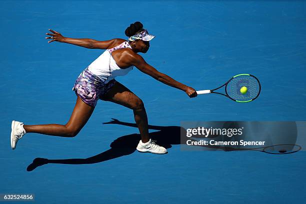 Venus Williams of the United States plays a backhand in her quarterfinal match against Anastasia Pavlyuchenkova of Russia on day nine of the 2017...