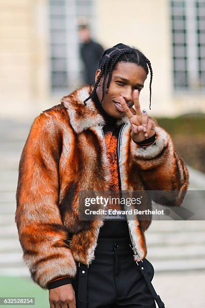 Rocky wears a brown fur coat, and attends the Christian Dior Haute Couture Spring Summer 2017 show as part of Paris Fashion Week, at the Rodin...