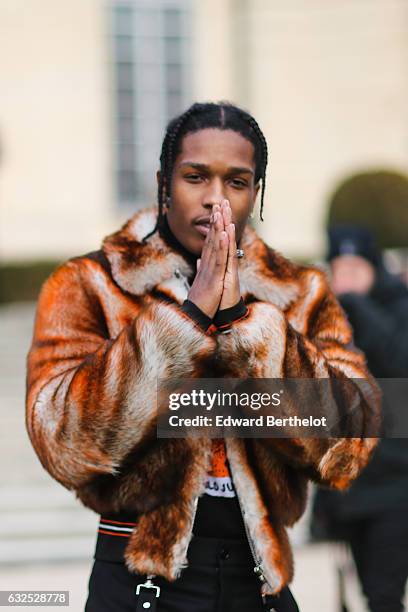 Rocky wears a brown fur coat, and attends the Christian Dior Haute Couture Spring Summer 2017 show as part of Paris Fashion Week, at the Rodin...