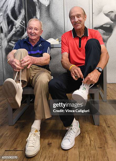 Rod Laver and Stan Smith pose with the adidas shoes named and designed in their honour at the adidas store at Grand Slam Oval during day nine of the...