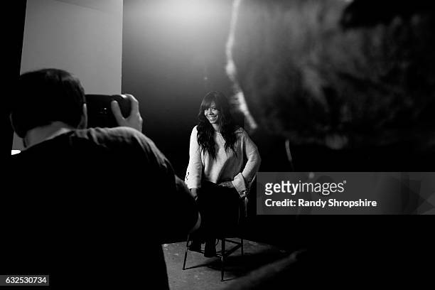 Actress Sanaa Lathan and photographer Jeff Vespa behind the scenes in the WireImage Portrait Studio at AT&T At The Lift during the 2017 Sundance Film...
