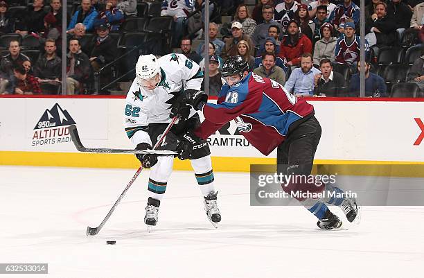 Patrick Wiercioch of the Colorado Avalanche fights for position against Kevin Labanc of the San Jose Sharks at the Pepsi Center on January 23, 2017...