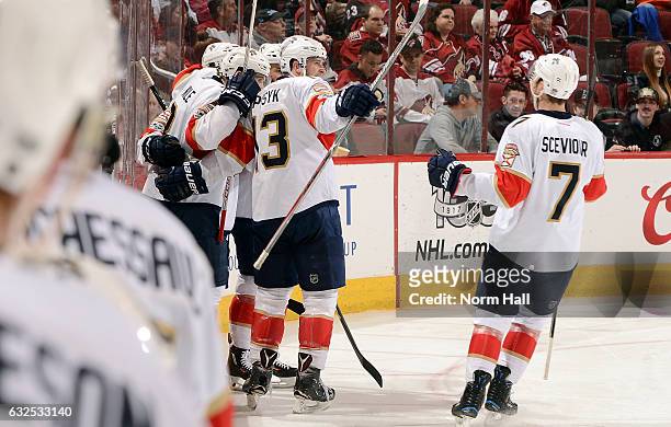 Jakub Kindl, Mark Pysyk and Colton Sceviour of the Florida Panthers celebrate a goal by teammate Michael Sgarbossa during the second period against...