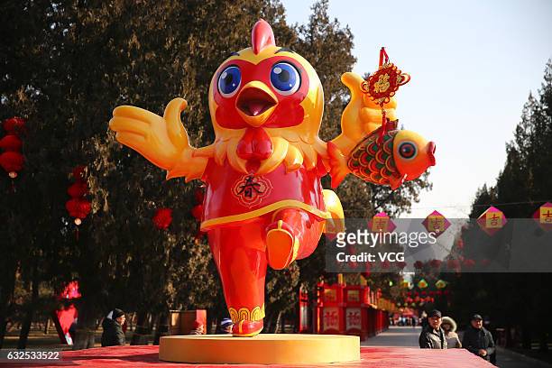 Sculpture of chicken seen at the Temple of Earth on January 23, 2017 in Beijing, China. To welcome the Year of Rooster, Chinese people post paper...