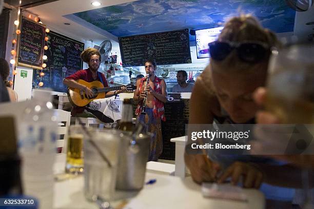 Musicians perform inside a restaurant in Koh Phangan, Surat Thani, Thailand, on Wednesday, Jan. 18, 2017. Government spending and investment in...