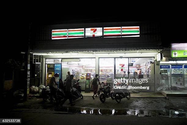 Eleven convenience store, operated by CP All Pcl, stands illuminated at night in Koh Phangan, Surat Thani, Thailand, on Tuesday, Jan. 17, 2017....