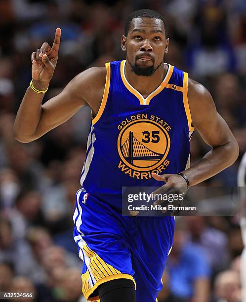 Kevin Durant of the Golden State Warriors reacts to a play during a game against the Miami Heat at American Airlines Arena on January 23, 2017 in...