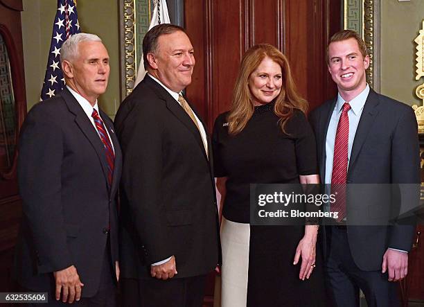 Vice President Mike Pence, from left, poses for a photograph with Representative Mike Pompeo, a Republican from Kansas, his wife Susan Pompeo and...