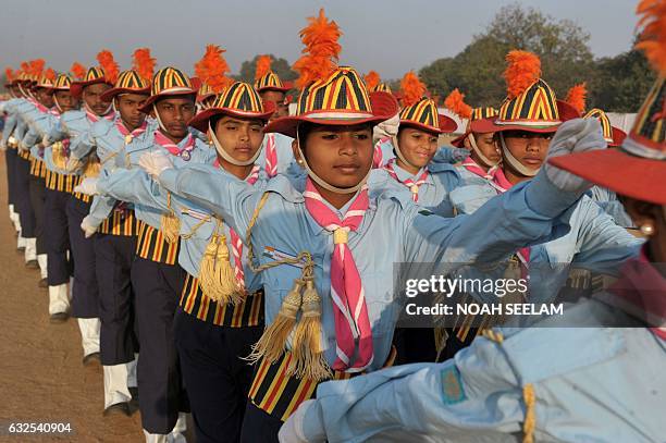 Members of the scouts and guides march past during a full dress rehearsal for the Indian Republic Day parade in Secunderabad, the twin city of...