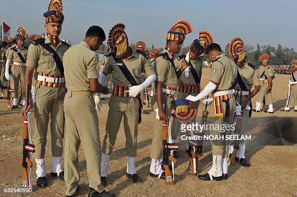 Members of the Odisha state Police personnel prepare to participate in a full dress rehearsal for the Indian Republic Day parade in Secunderabad, the...