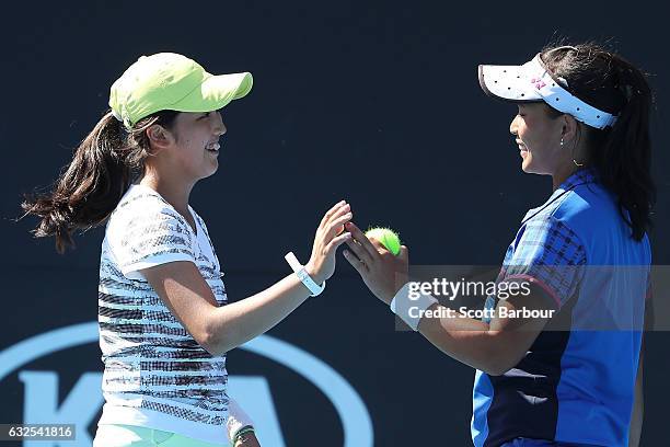 Pei Hsuan Chen of Taipei and Naho Sato of Japan compete in their second round match against Bianca Vanessa Andreescu of Canada and Carson Branstine...