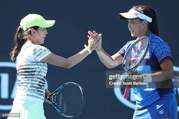 Pei Hsuan Chen of Taipei and Naho Sato of Japan compete in their second round match against Bianca Vanessa Andreescu of Canada and Carson Branstine...