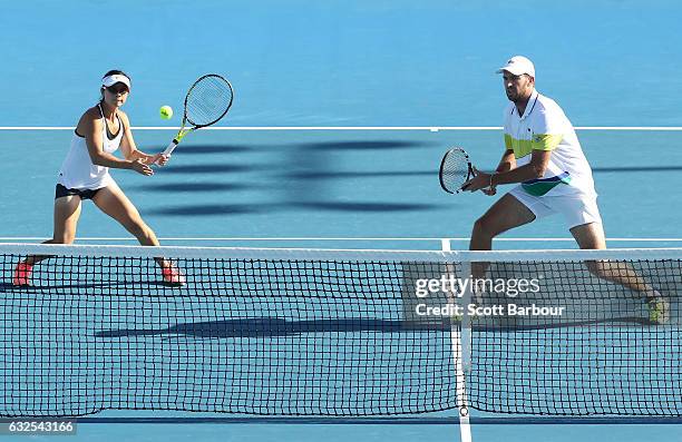 Yifan Xu of China and Fabrice Martin of France compete in their second round match against Bethanie Mattek-Sands and Mike Bryan of the United States...