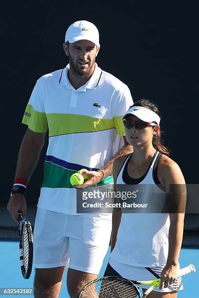 Yifan Xu of China and Fabrice Martin of France compete in their second round match against Bethanie Mattek-Sands and Mike Bryan of the United States...