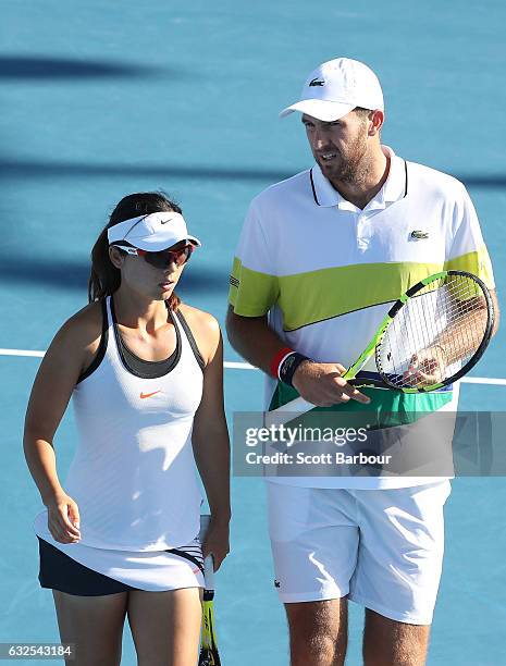 Yifan Xu of China and Fabrice Martin of France compete in their second round match against Bethanie Mattek-Sands and Mike Bryan of the United States...