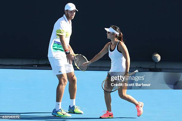 Yifan Xu of China and Fabrice Martin of France compete in their second round match against Bethanie Mattek-Sands and Mike Bryan of the United States...