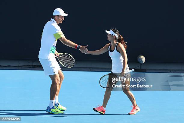 Yifan Xu of China and Fabrice Martin of France compete in their second round match against Bethanie Mattek-Sands and Mike Bryan of the United States...