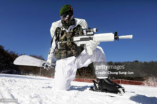 South Korean marine participate in the winter military training exercise with South Korean soldiers on January 24, 2017 in Pyeongchang-gun, South...