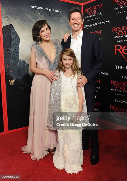 Actress Milla Jovovich, husband/director Paul W.S. Anderson and daughter Ever Gabo Anderson arrive at the premiere of Sony Pictures Releasing's...