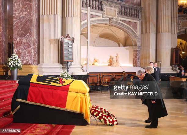 German President Joachim Gauck and Alexandra Freifrau von Berlichingen, widow of late German President Roman Herzog, stand in front of his coffin...