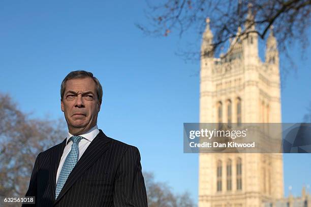 Former UKIP leader Nigel Farage conducts a television interview in Victoria Tower Gardens on January 24, 2017 in London, England. Judges ruled by a...