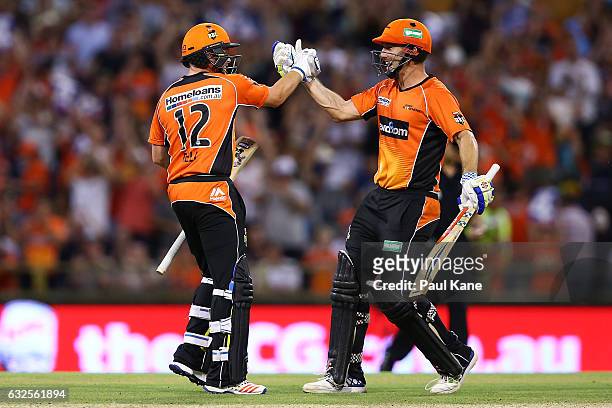 Ian Bell and Shaun Marsh of the Scorchers celebrate winning the Big Bash League match between the Perth Scorchers and the Melbourne Stars at the WACA...