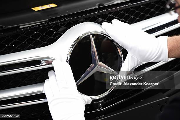 The emblem of a Mercedes-Benz of C-Class car is pictured on the assembly line of Mercedes-Benz on January 24, 2017 in Bremen, Germany. Daimler AG,...