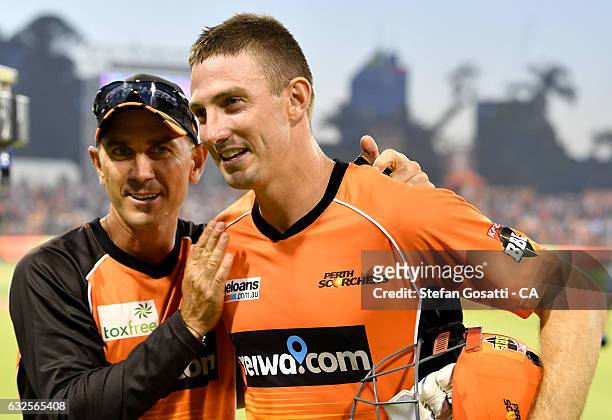 Justin Langer congratulates Shaun Marsh of the Scorchers after their victory over the Stars during the Big Bash League match between the Perth...
