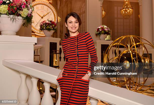 Olga Kurylenko visits the IWC booth during the launch of the Da Vinci Novelties from the Swiss luxury watch manufacturer IWC Schaffhausen at the...