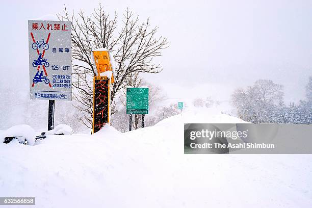 Snow-covered Yonago Expressway Hiruzen Interchange is seen on January 24, 2017 in Maniwa, Okayama, Japan. Heavy snow trapped hundreds of vehicles in...