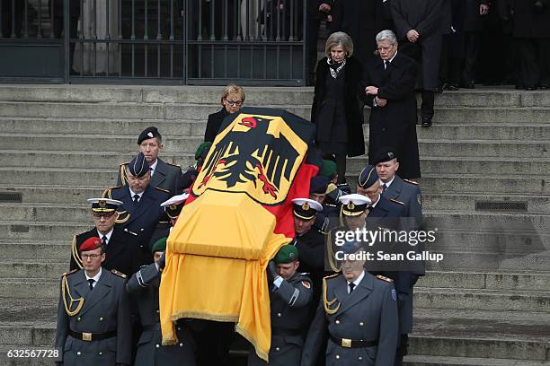 Baroness Alexandra von Berlichingen, widow of former German President Roman Herzog, and German President Joachim Gauck follow pallbearers carrying...
