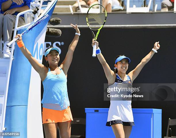 Japan's Eri Hozumi and Miyu Kato celebrate after defeating Croatia's Mirjana Lucic-Baroni and German Andrea Petkovic 6-3, 6-3 in the women's doubles...