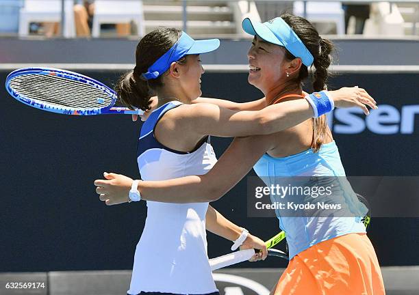 Japan's Miyu Kato and Eri Hozumi celebrate after winning their doubles quarterfinal match of the Australian Open in Melbourne on Jan. 24, 2017. They...
