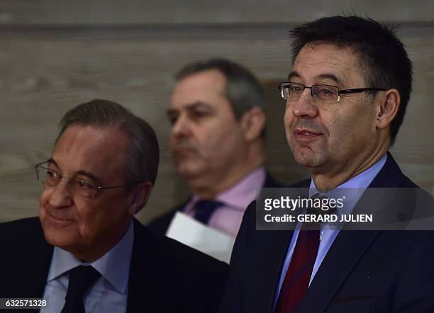 Real Madrid President Florentino Perez and Barcelona President Josep Maria Bartomeu wait during the presentation of a PRISA and UNESCO awarness...